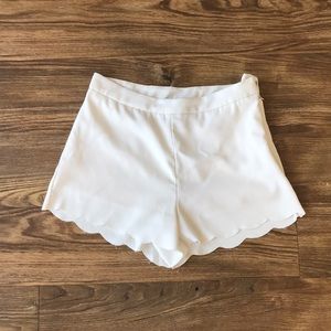 White high waisted shorts with scalloped hem